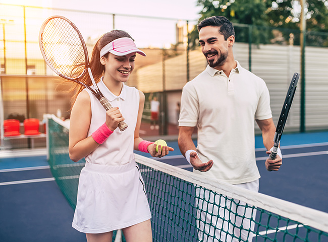 Two people on tennis court