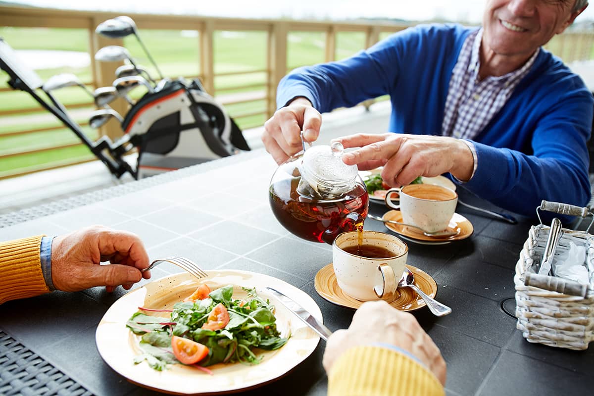 Couple enjoying lunch with tea